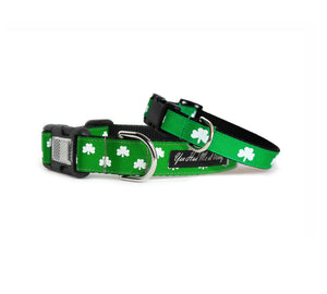 Dog collar with black webbing and kelly green trim with two rows of white shamrocks, shown with a small dog collar with one row of white shamrocks.