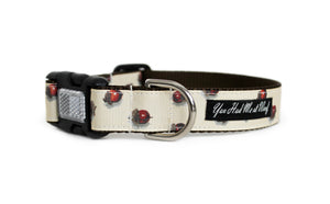 Dog collar in off-white with realistic acorns down the length of the collar, featuring an optional reflective buckle for visibility.