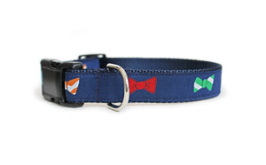 Cute dog collar in navy blue with colorful bow ties in green, blue, orange, and red down the length of the collar.