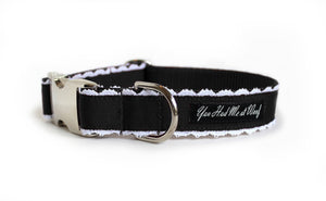 The Collette Dog Collar in black with white lace trim peeking out on each side.