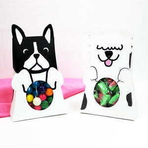 Dog favor boxes, a black and white French Bulldog, or a white Sheepdog, featuring a display window on their tummies for food or party favors.