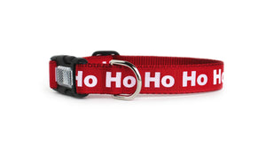 The Ho Ho Ho Dog Collar in all red with the text, Ho Ho Ho in all white letters with optional reflective buckle by You Had Me at Woof.