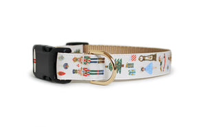 The Nutcracker Dog Collar in cream with gold glittering Nutcracker ballet characters, presents, ornaments, and a Christmas tree.